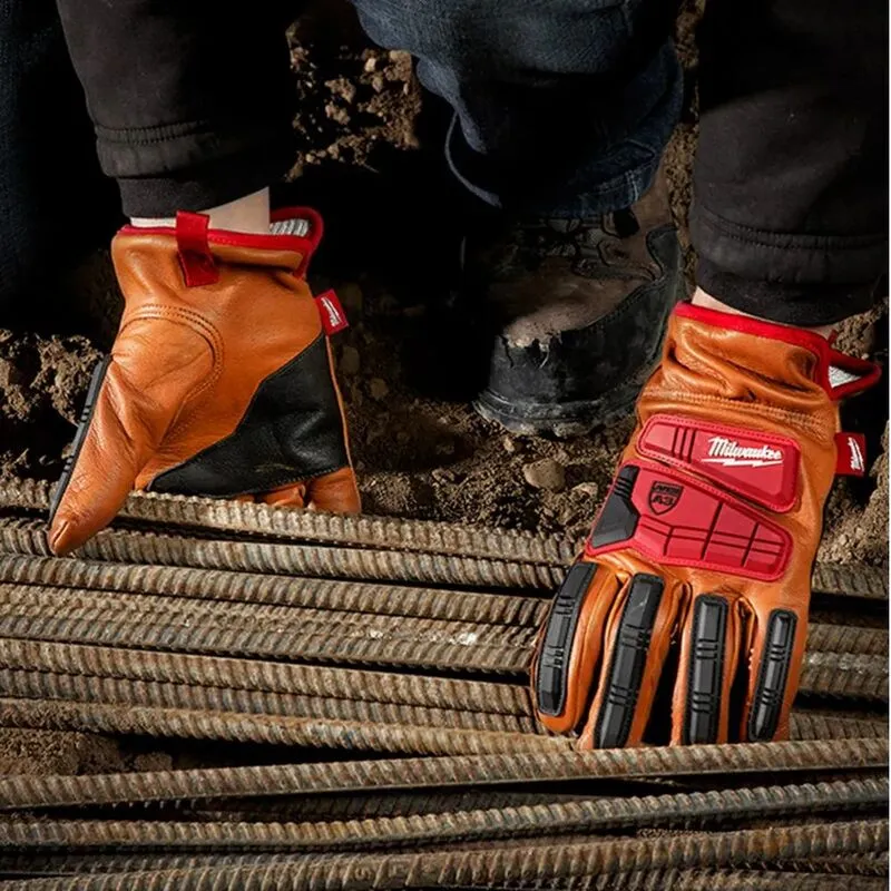 Orange leather safety gloves with impact guards on steel bars