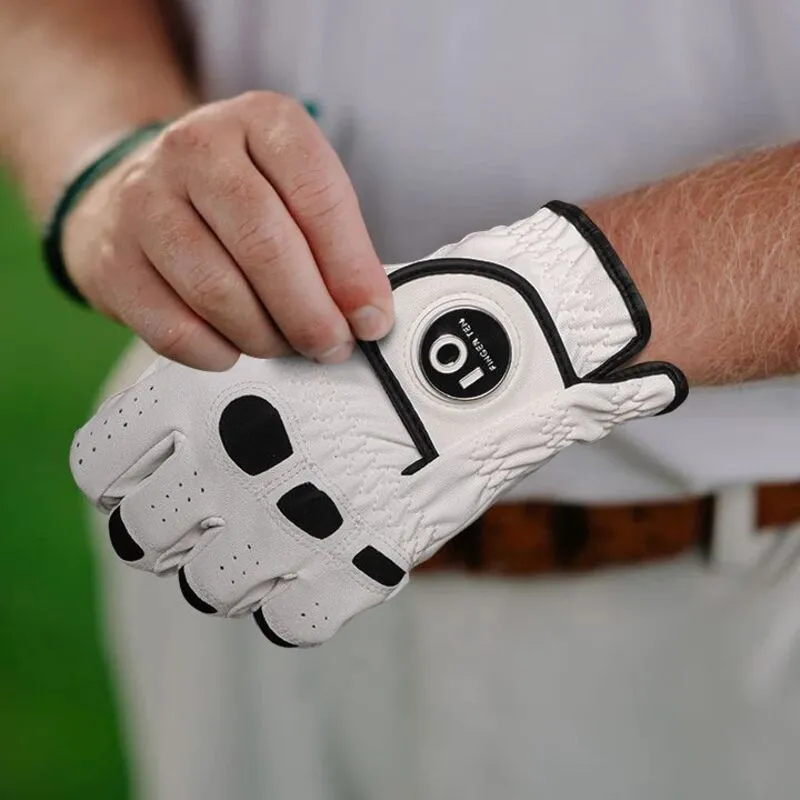 Golfer adjusting a white leather glove with black accents