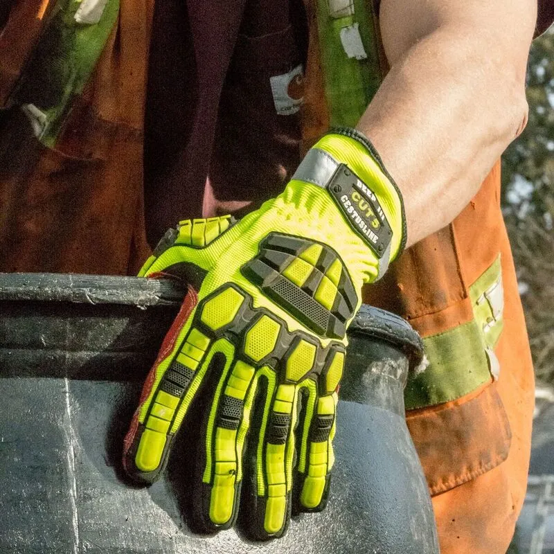 Worker wearing neon yellow impact gloves for hand protection